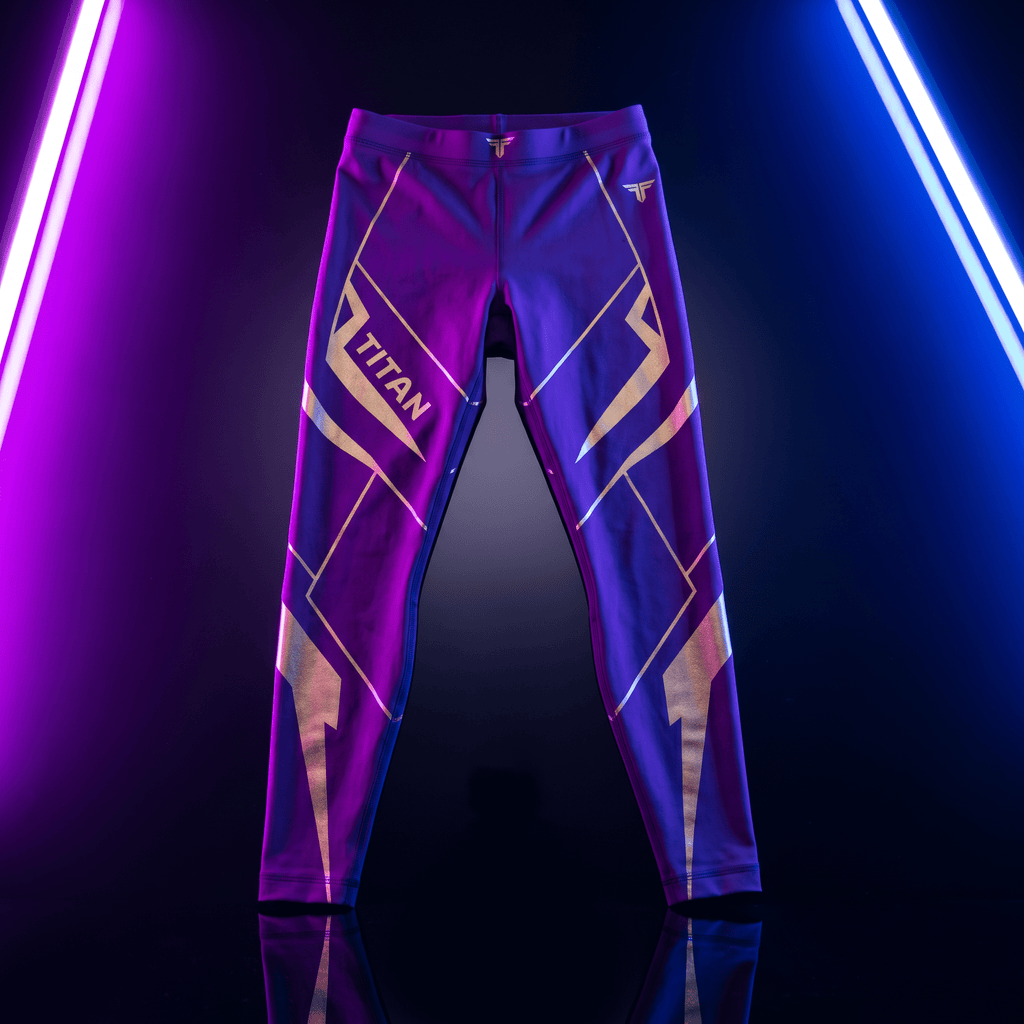 Purple Titan athletic compression leggings with metallic gold geometric accents, displayed against neon lighting.