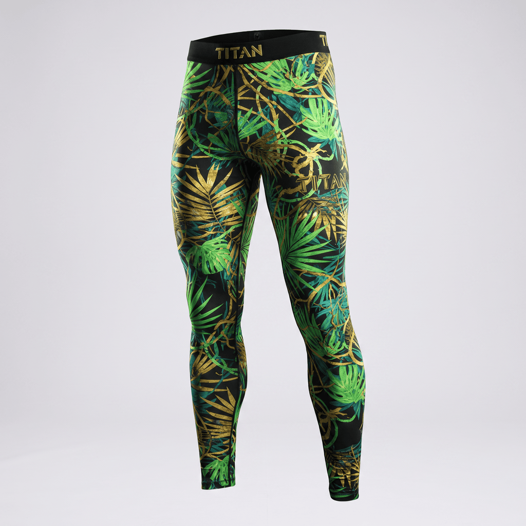 Titan athletic leggings in black with a green and gold tropical leaf print and black waistband.