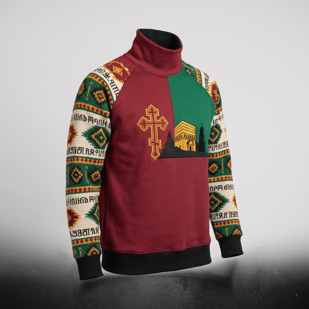 Maroon and green turtleneck sweatshirt featuring an embroidered cross, church building, and patterned sleeves.