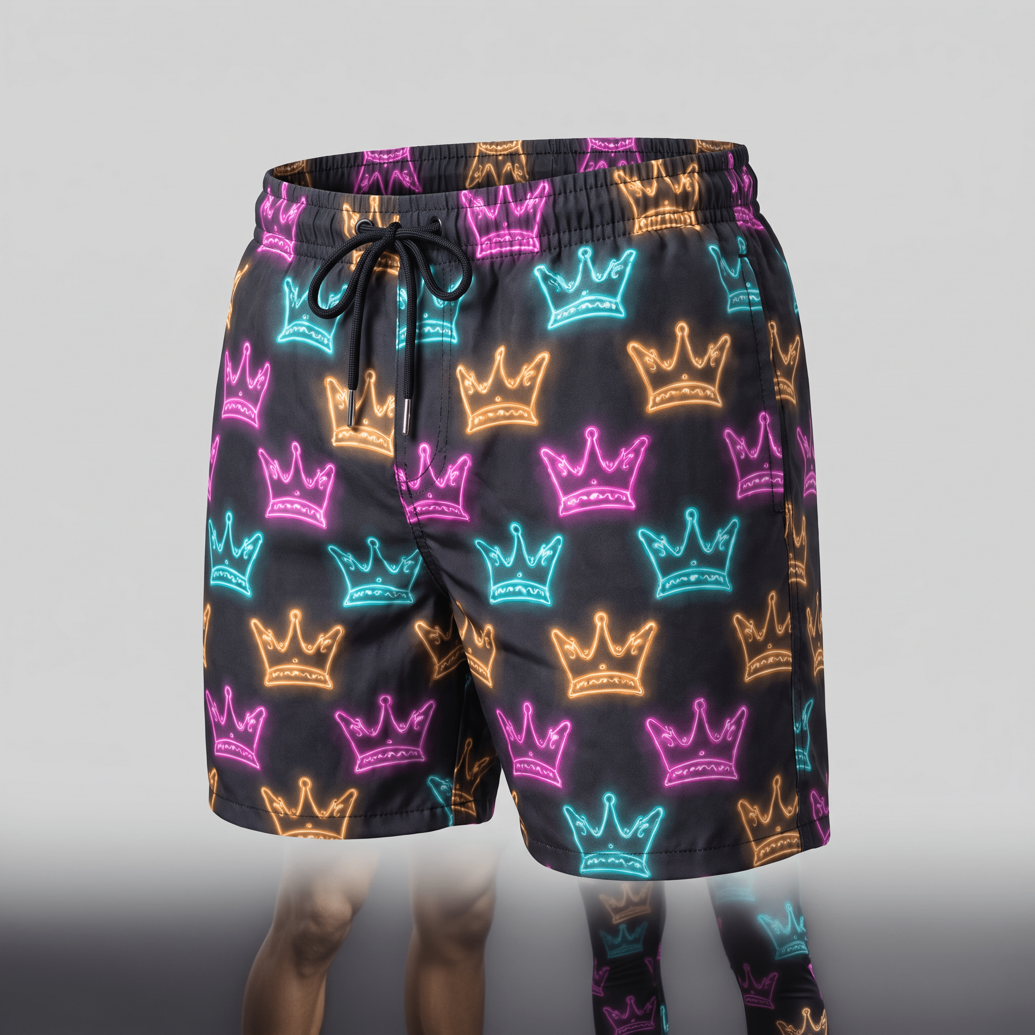 Black swim trunks featuring an all-over neon crown print in pink, blue, and orange with a black drawstring waist.