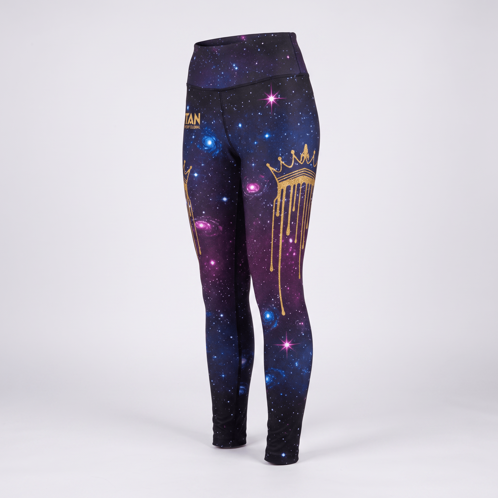 High-waisted athletic leggings with a purple and blue galaxy print, featuring a gold crown and drip design.
