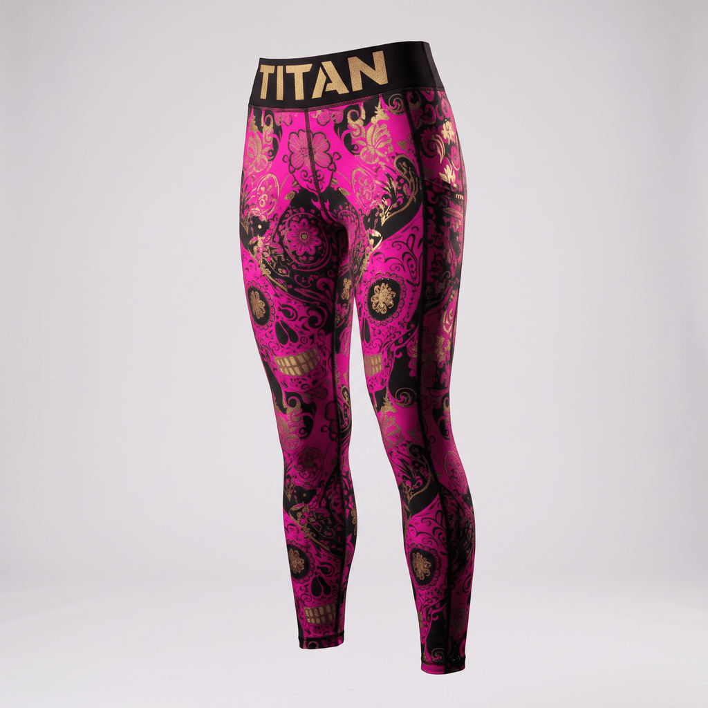 Titan pink and black sugar skull print athletic leggings with a gold waistband.