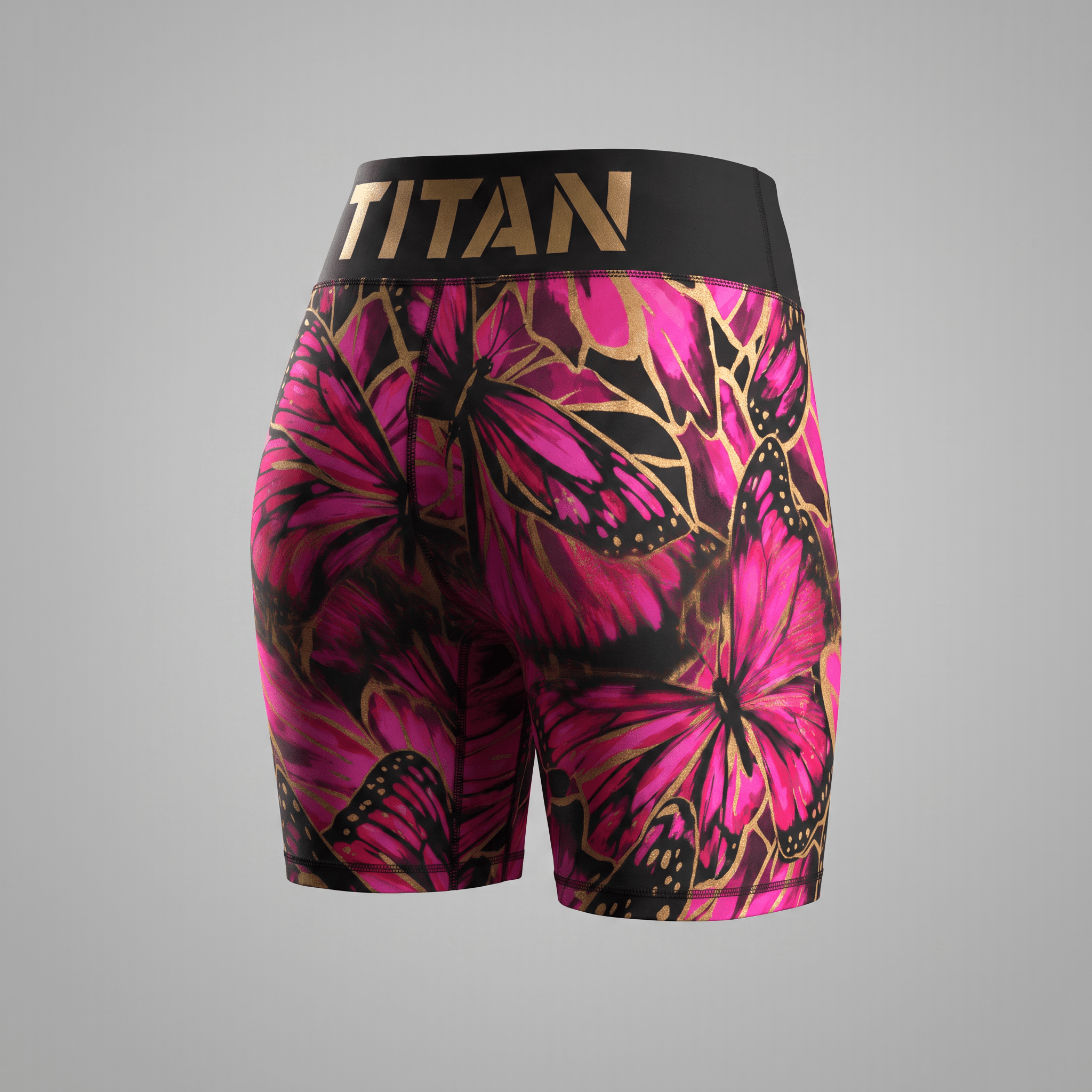 Back view of black athletic shorts featuring a pink and gold butterfly print and a wide Titan waistband.