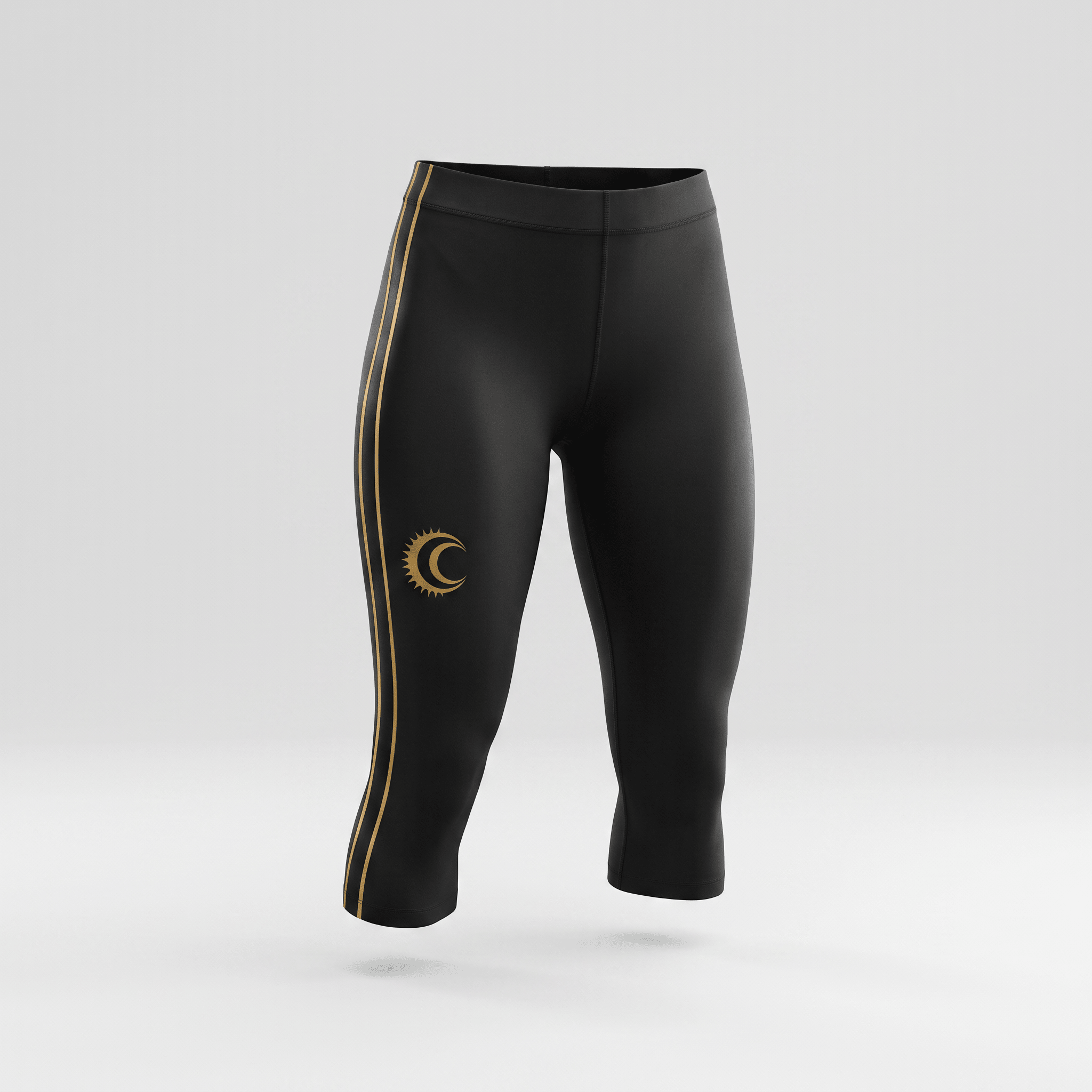 Black cropped athletic leggings with gold side stripes and sun-and-moon logo on right thigh.