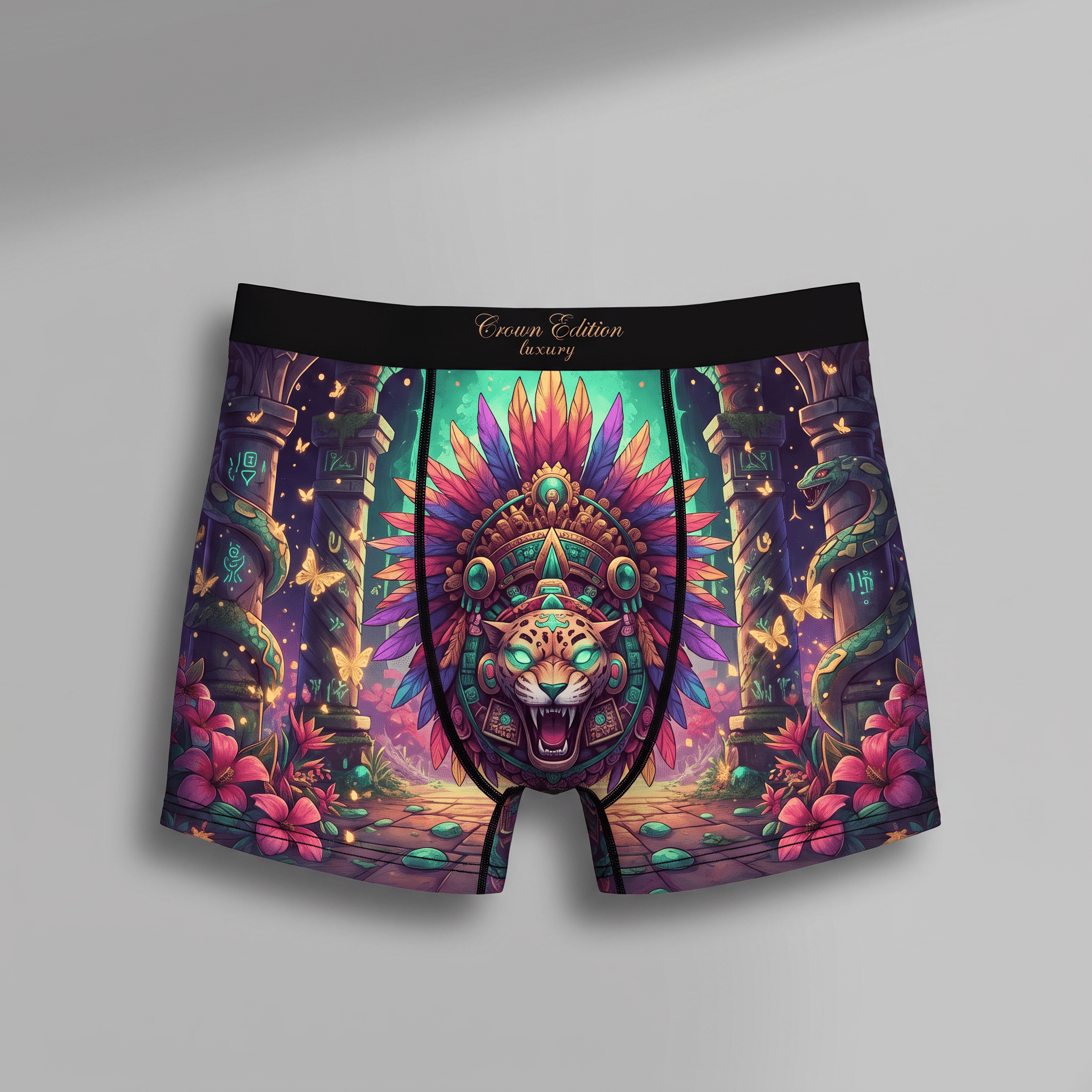 Black boxer briefs featuring a colorful Aztec leopard headdress print, ruins, and pink flowers.