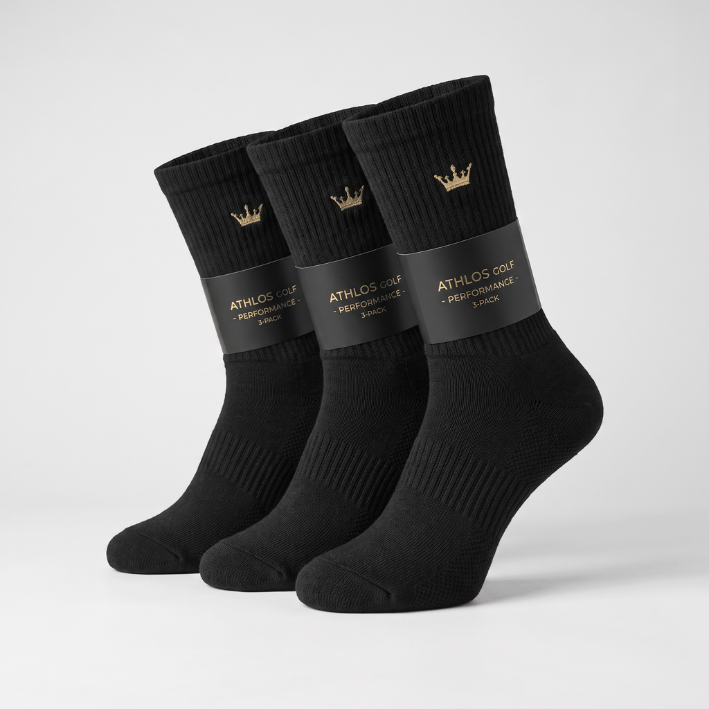 Three-pack of black crew socks with gold crown logo, wrapped in Athlos Golf branding.
