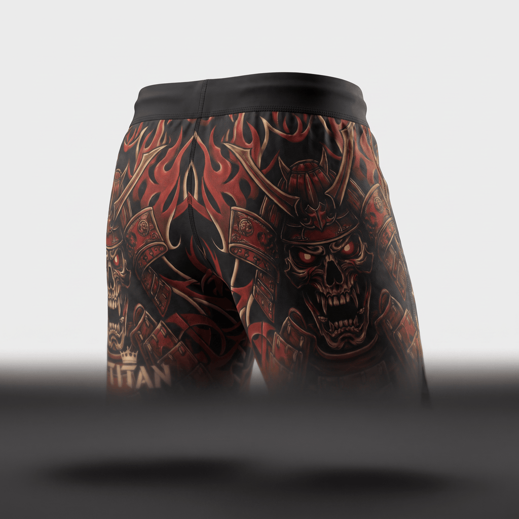 Back view of black training shorts featuring a red samurai skull and flame graphic design.