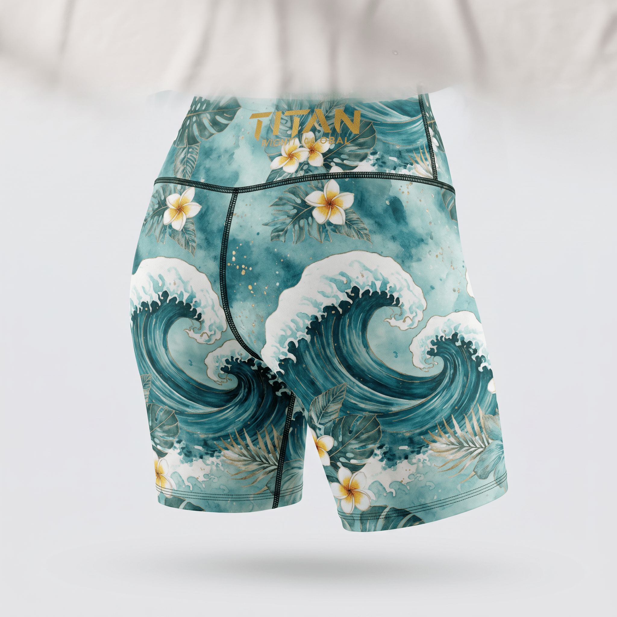 Teal athletic shorts featuring a watercolor ocean wave and tropical flower print, back view.