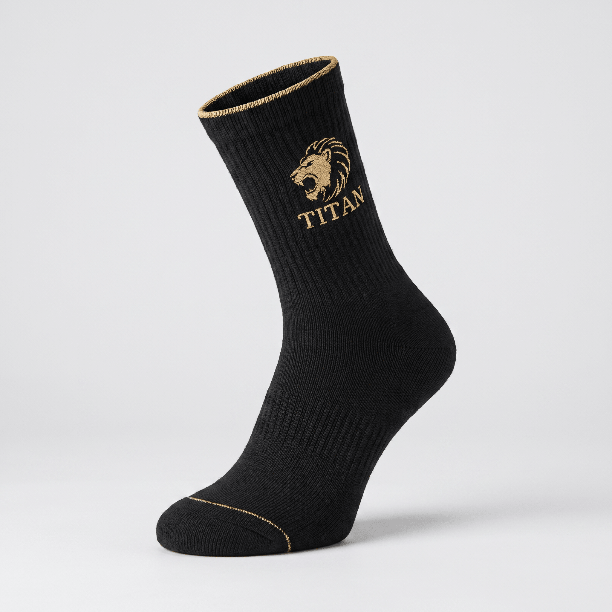 Black athletic crew sock with gold Titan lion logo and gold trim on cuff and toe against light gray background.