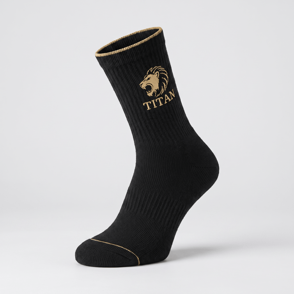 Black crew sock with gold lion head logo and Titan text on ribbed fabric against a light background.