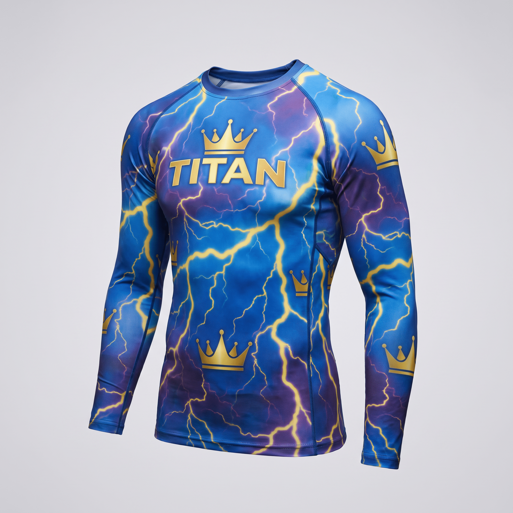 Blue long-sleeve rash guard with yellow lightning and gold crown graphics featuring the word TITAN on the chest.