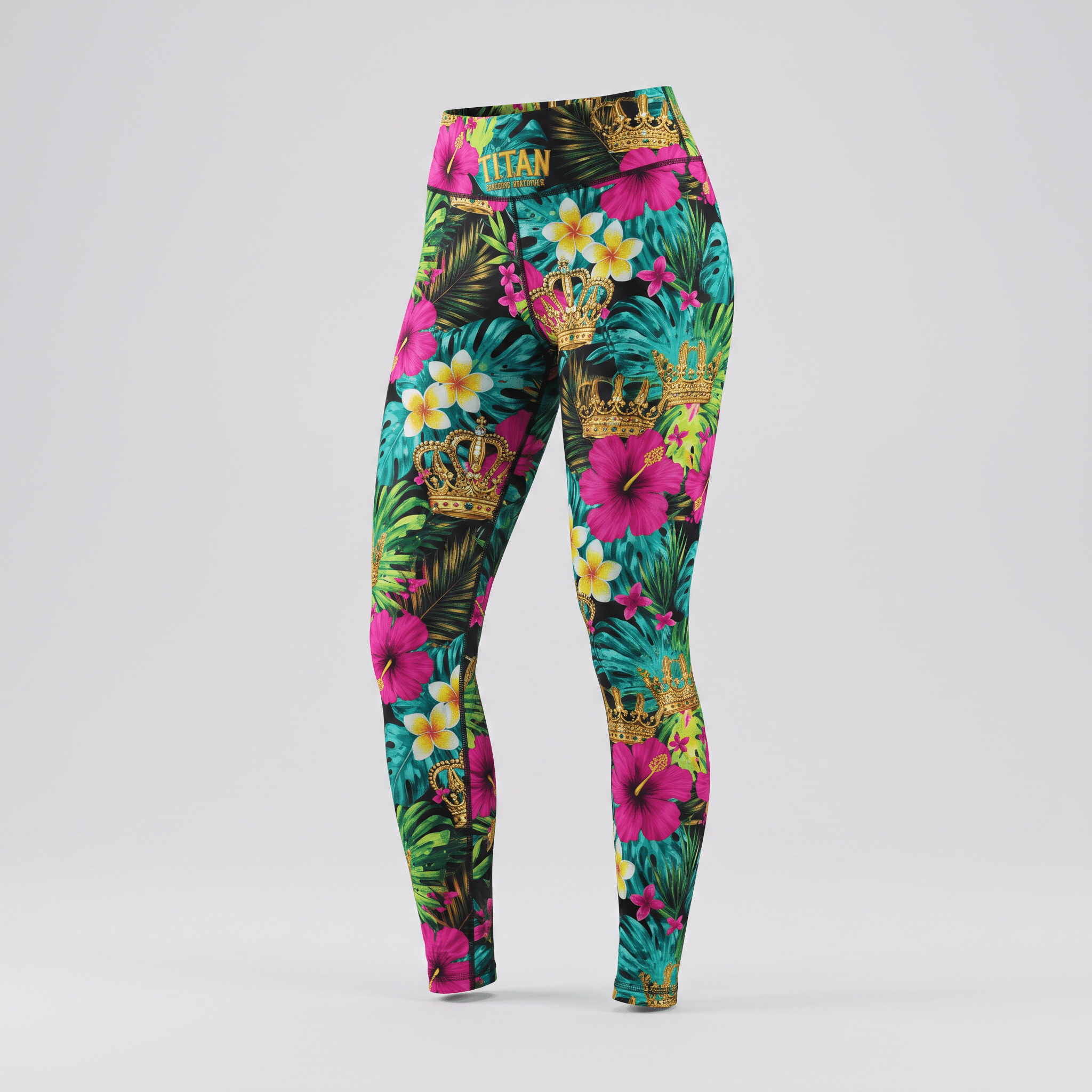 High-waisted athletic leggings with a colorful tropical print, pink hibiscus flowers, and gold crowns on black.