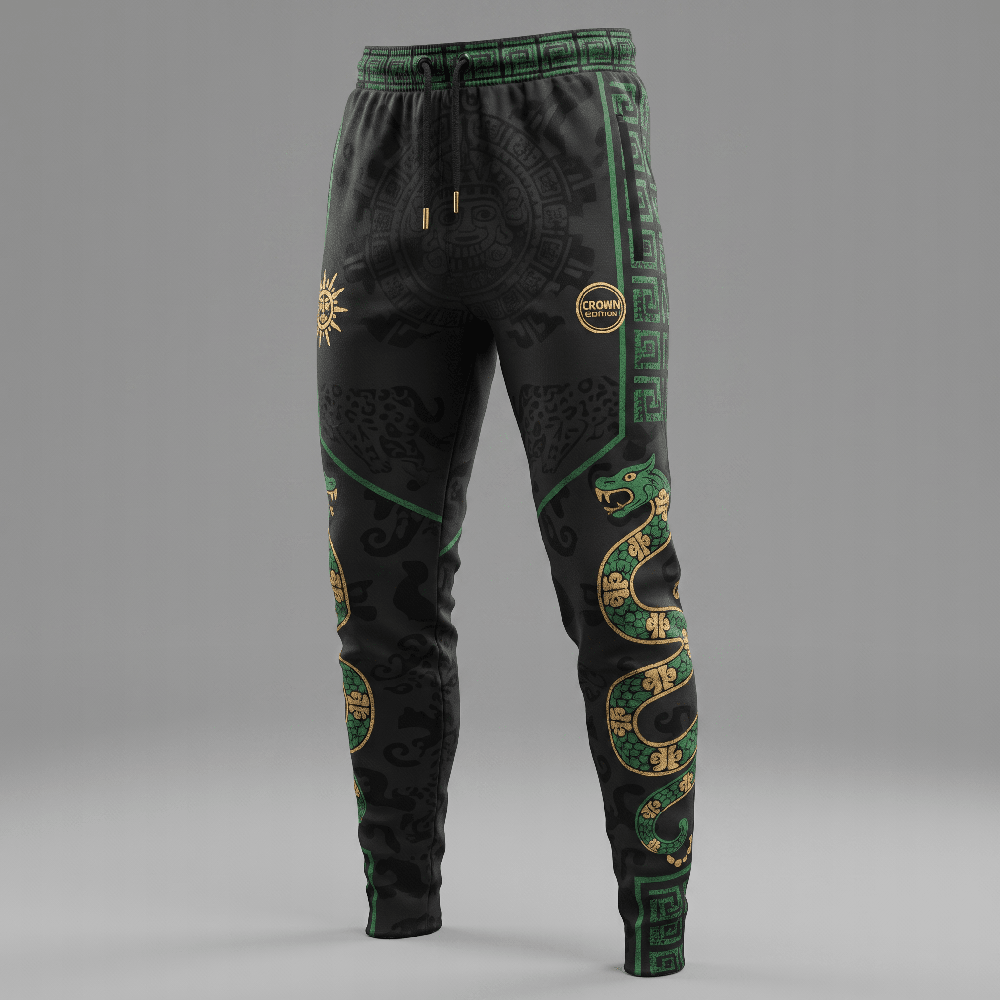 Black sweatpants with green and gold Aztec patterns, featuring serpentine and sun motifs against a grey background.