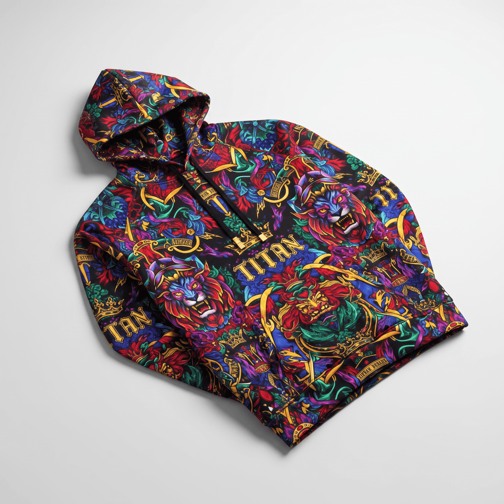 Black hoodie with colorful allover lion and crown graphic print on white background.