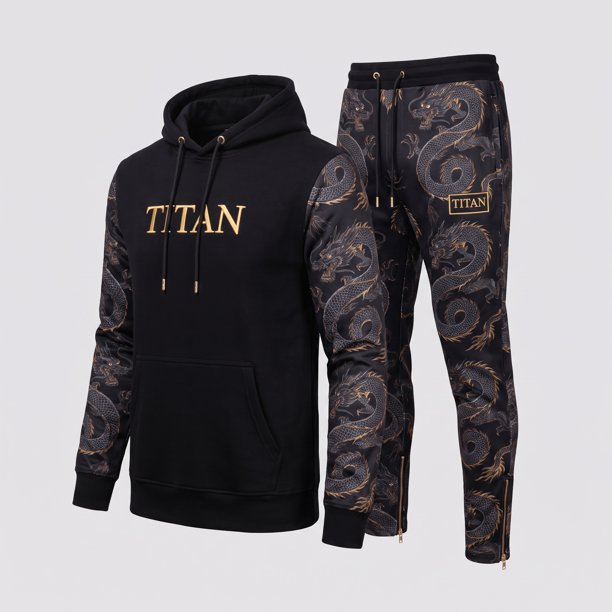 Black Titan tracksuit with gold dragon print sleeves and matching joggers against a light background.