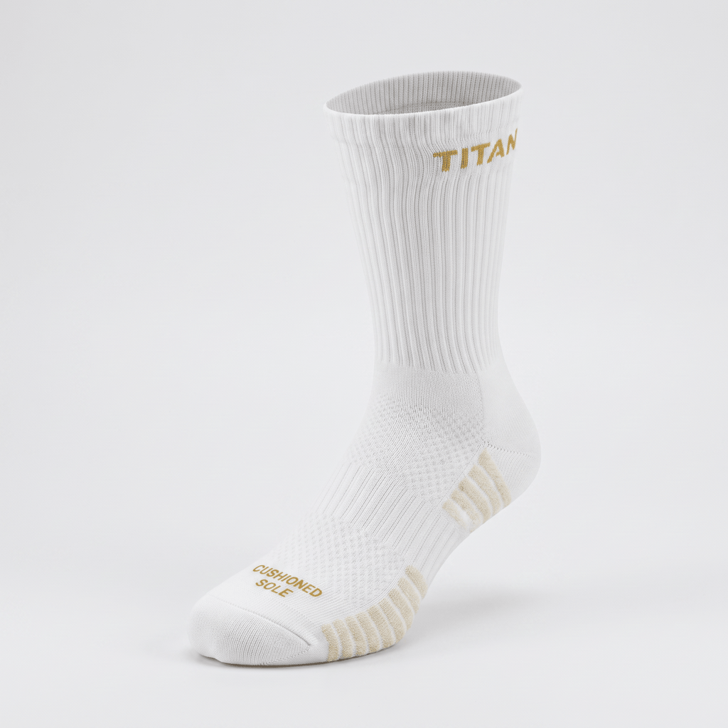 White ribbed crew sock with gold Titan logo and cushioned sole text against a light grey background.