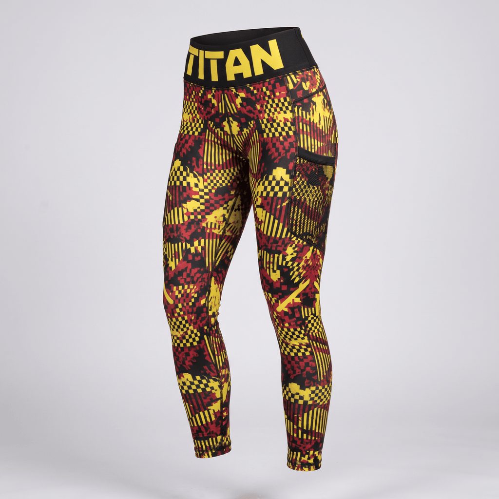 Titan athletic leggings in red and yellow pixelated camo with black waistband and side pockets.