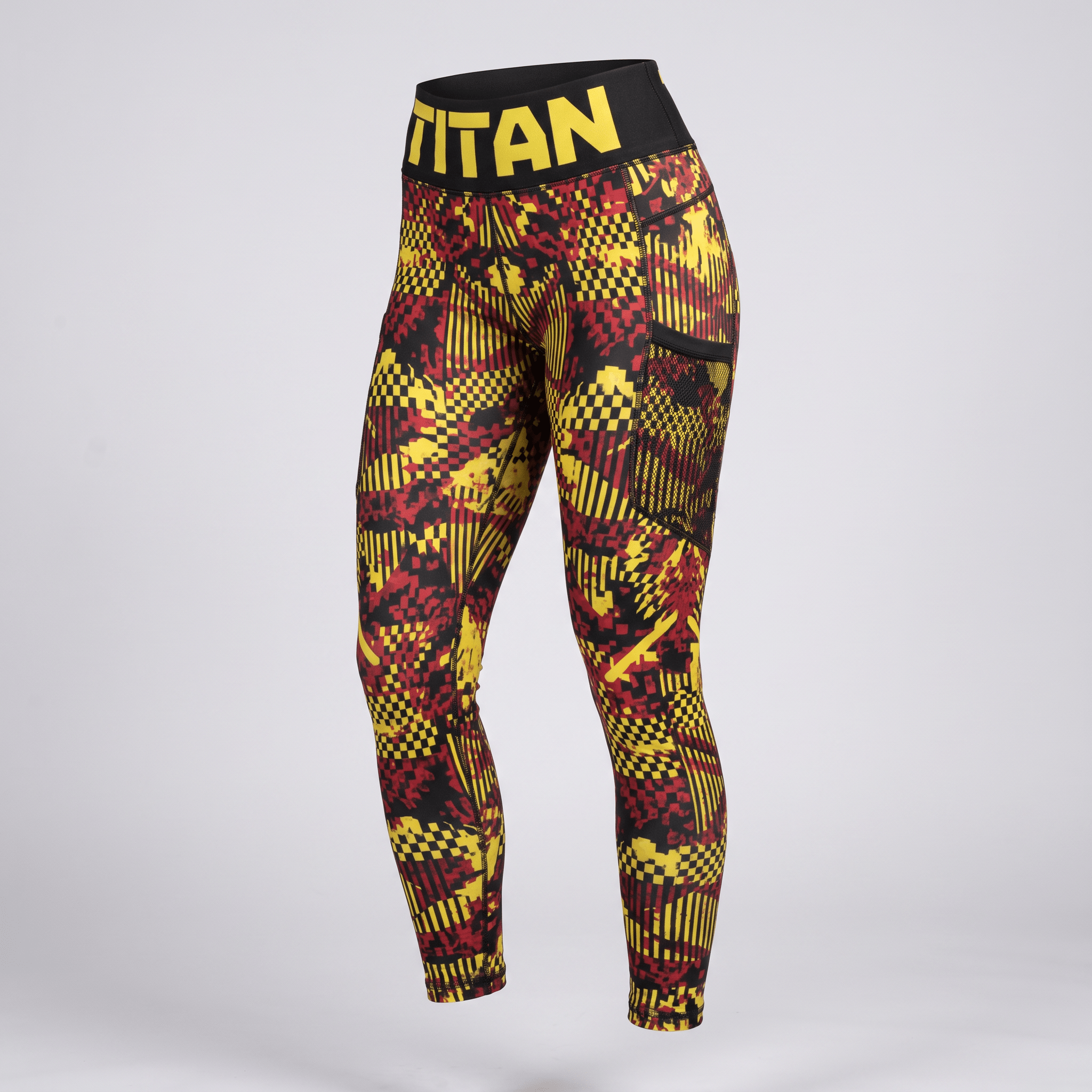 Titan athletic leggings in red and yellow pixelated camo with black waistband and side pockets.