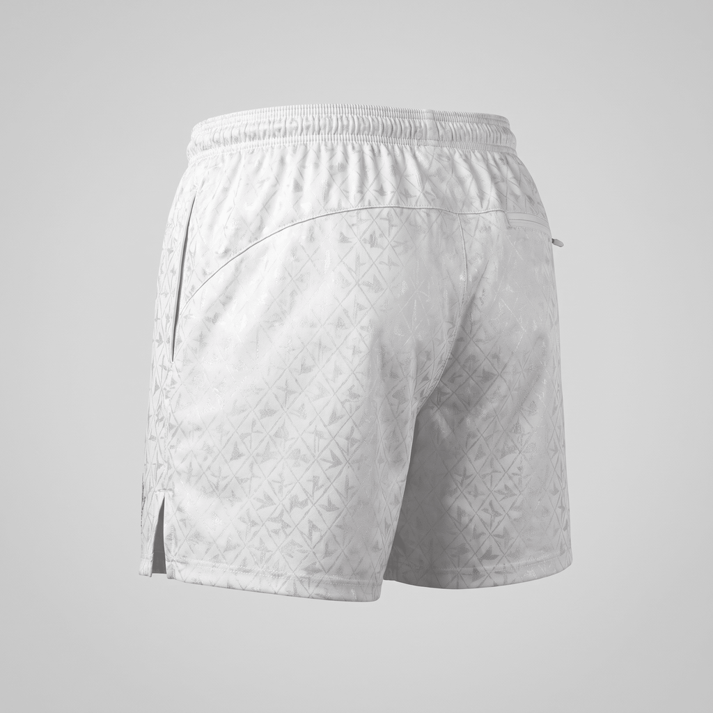 Back view of white athletic shorts featuring an all-over diamond pattern, elastic waistband, and side slit hem.
