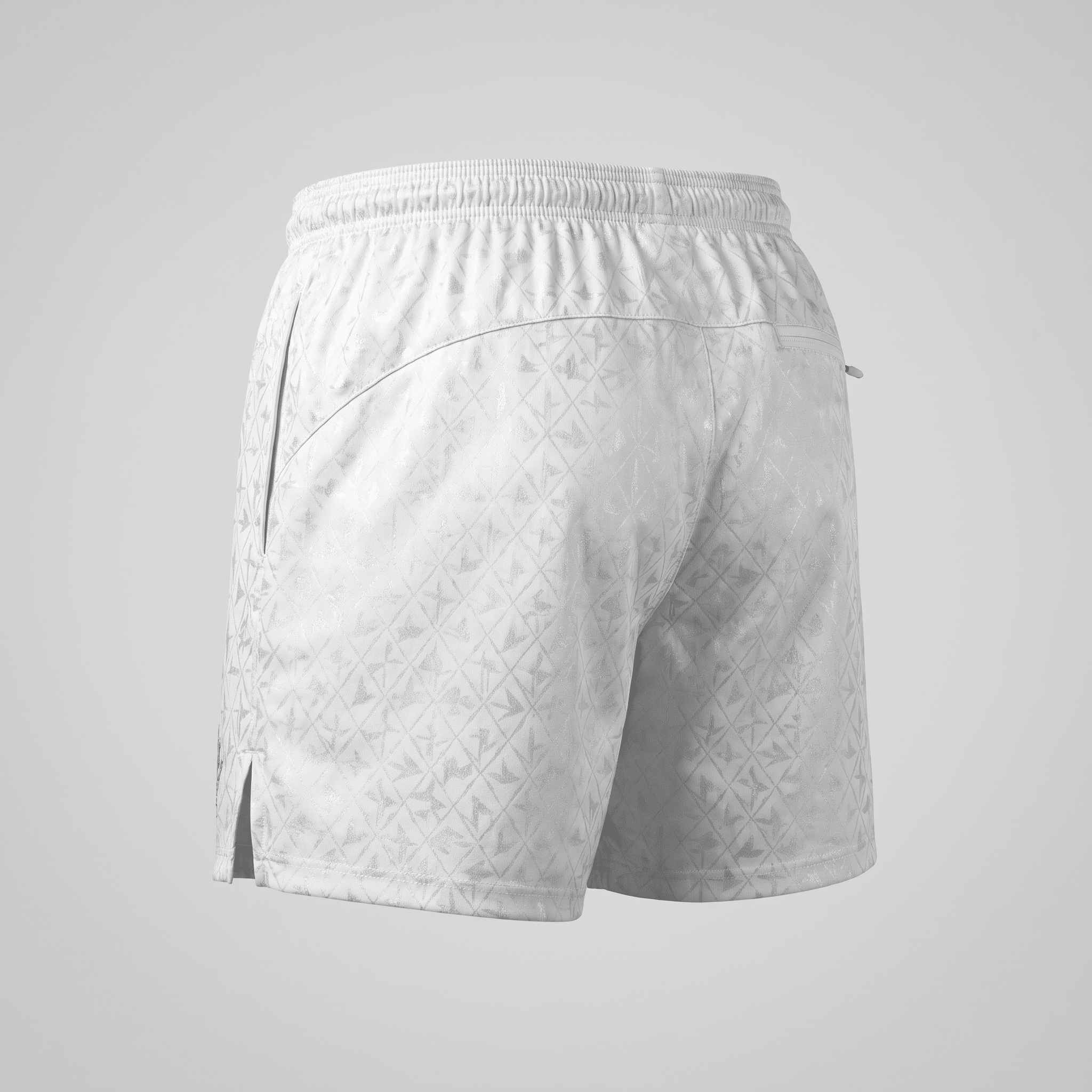 Back view of white athletic shorts featuring an all-over diamond pattern, elastic waistband, and side slit hem.