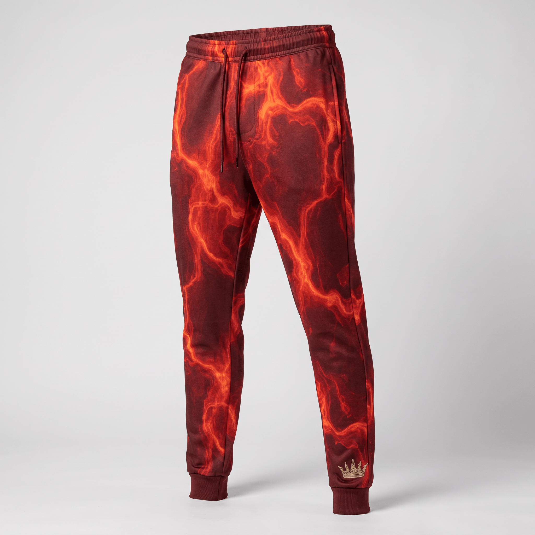 Red and orange fire-patterned athletic sweatpants with a drawstring waist and ribbed cuffs.