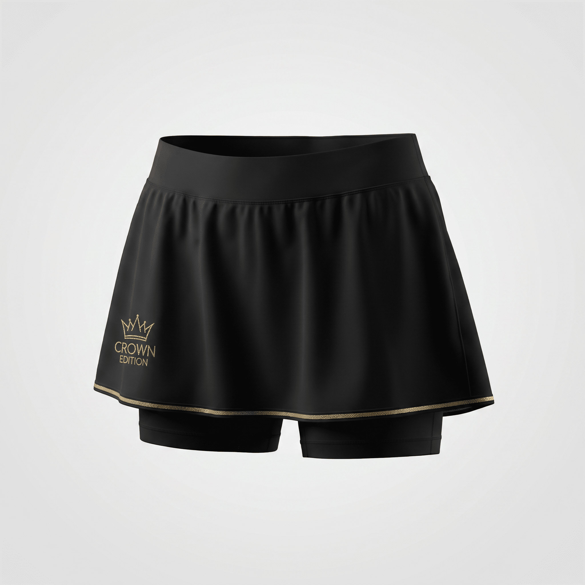 Black athletic skirt with built-in shorts, gold hem trim, and a gold Crown Edition logo on the lower right.