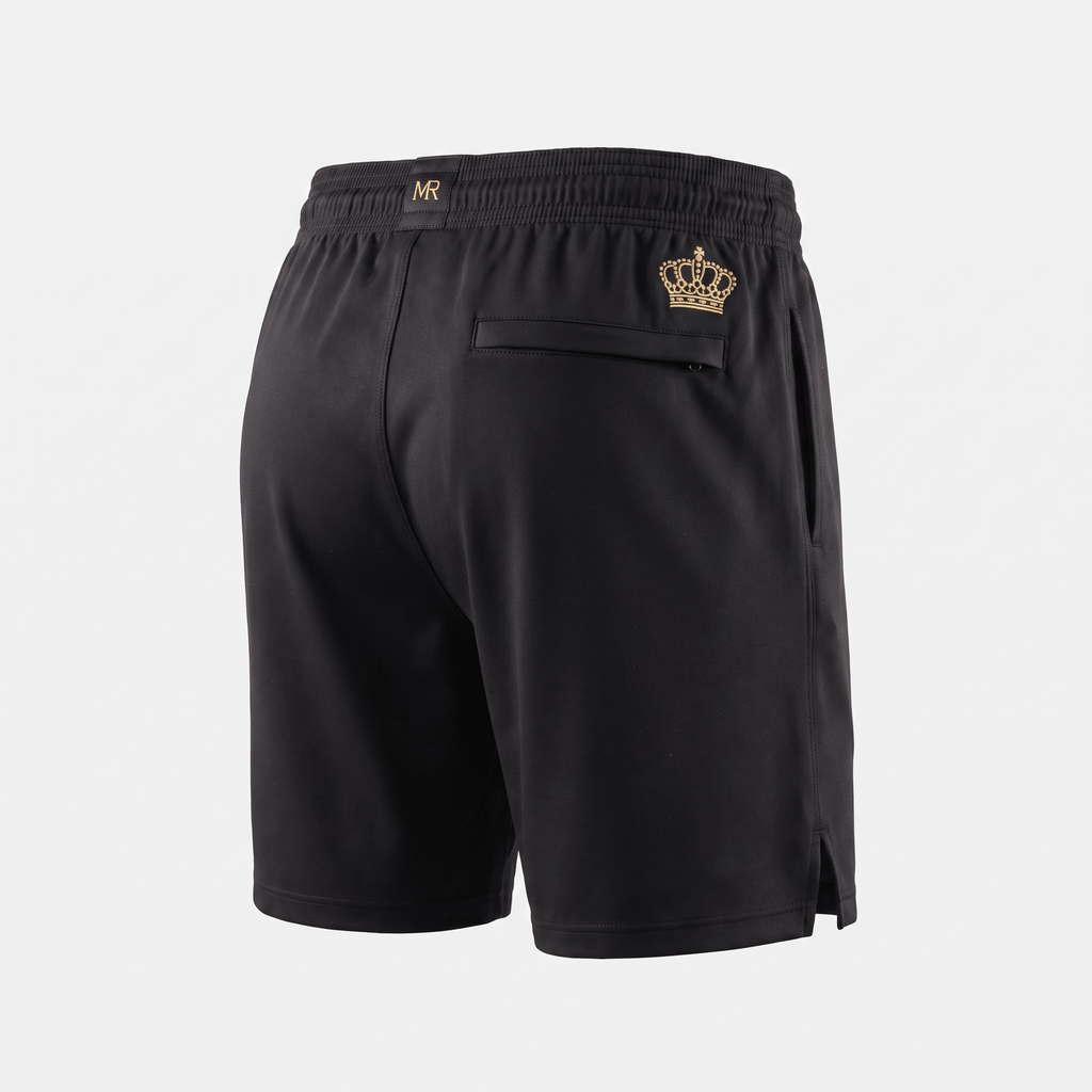 Back view of black athletic shorts with gold crown logo, MR branding on waistband, and a zippered back pocket.