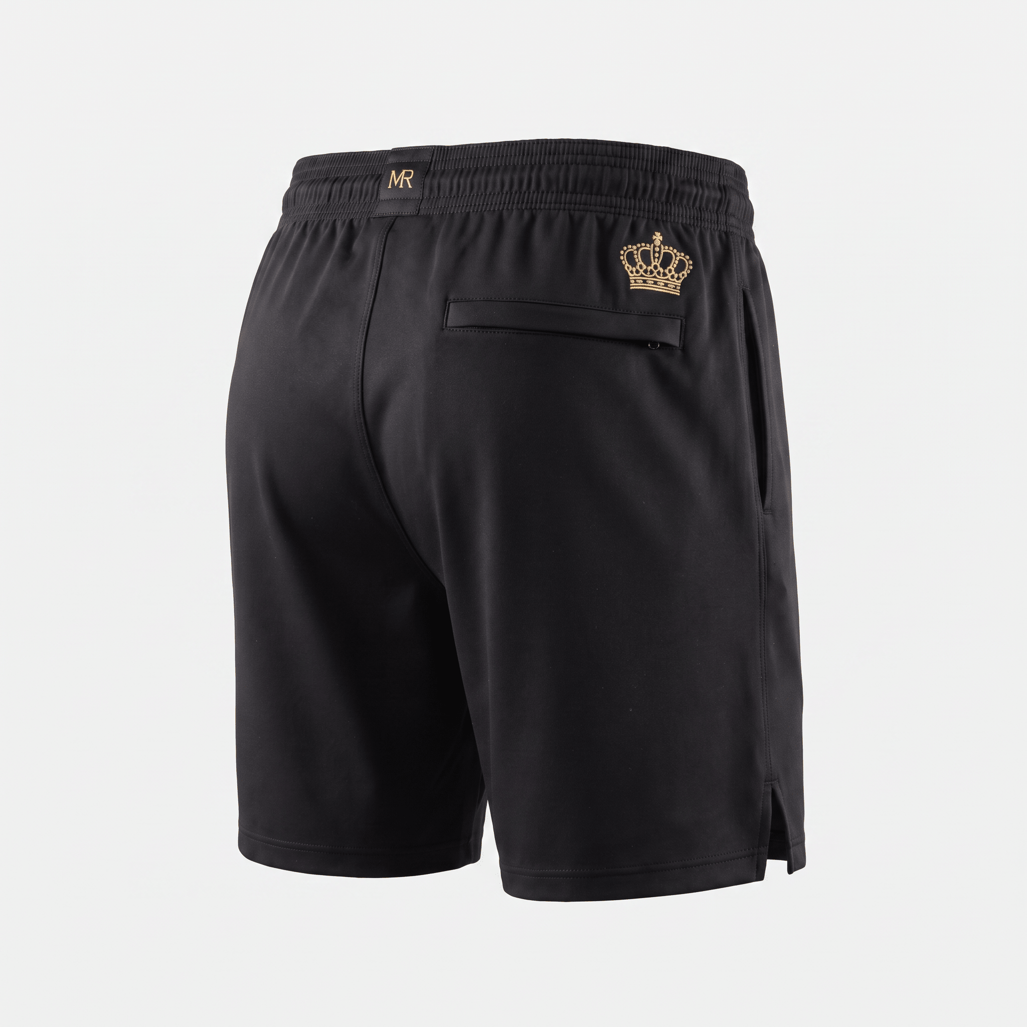 Back view of black athletic shorts with gold crown logo, MR branding on waistband, and a zippered back pocket.