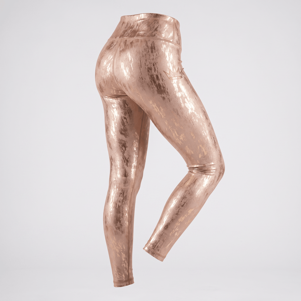Rose gold metallic high-waisted activewear leggings with subtle distressed finish shown from the back.