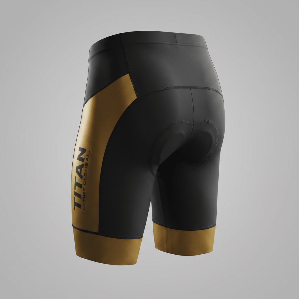 Rear view of black and gold Titan Sport cycling shorts with padded seat and side branding.