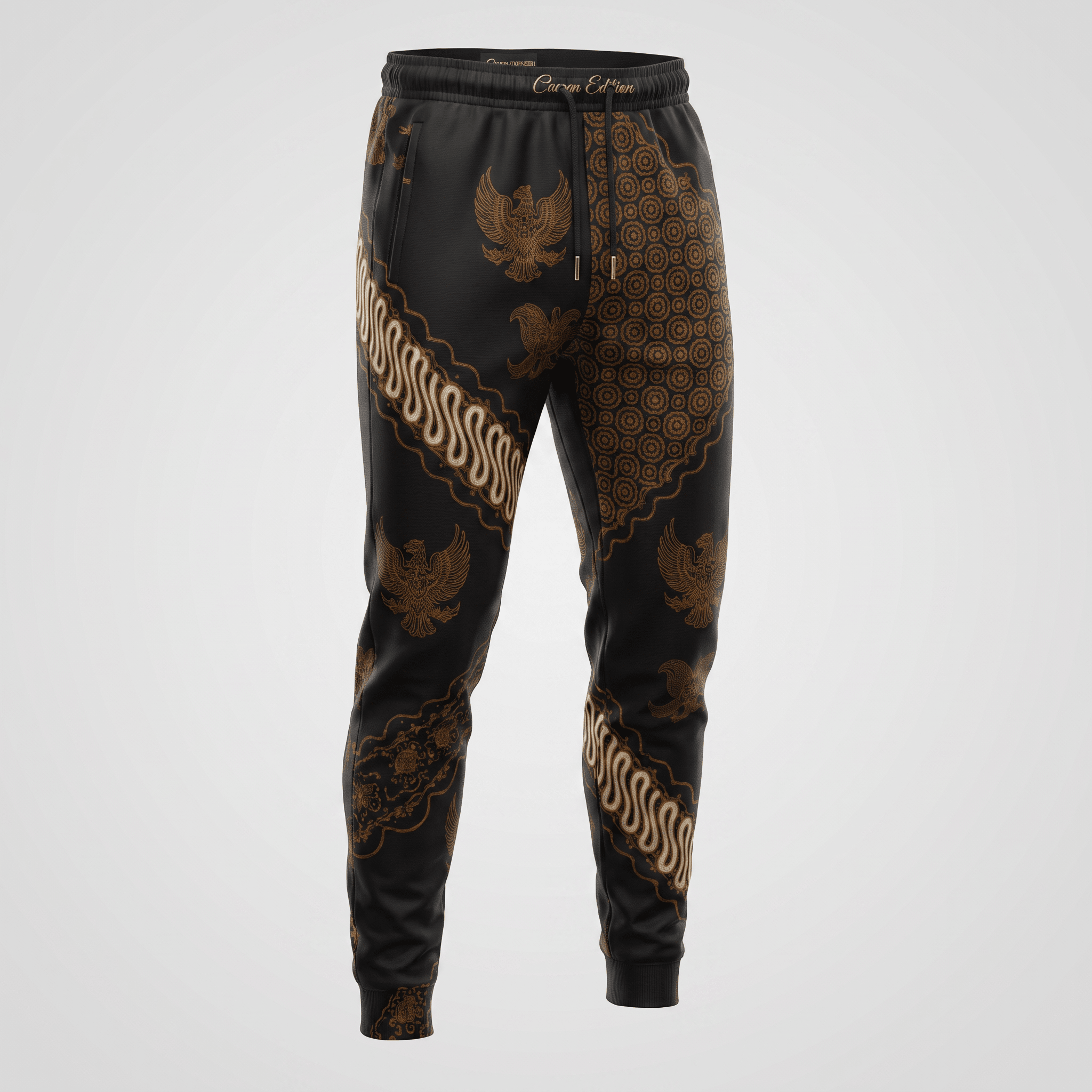 Black joggers with gold Indonesian batik pattern, featuring traditional eagle motifs and drawstring waist.
