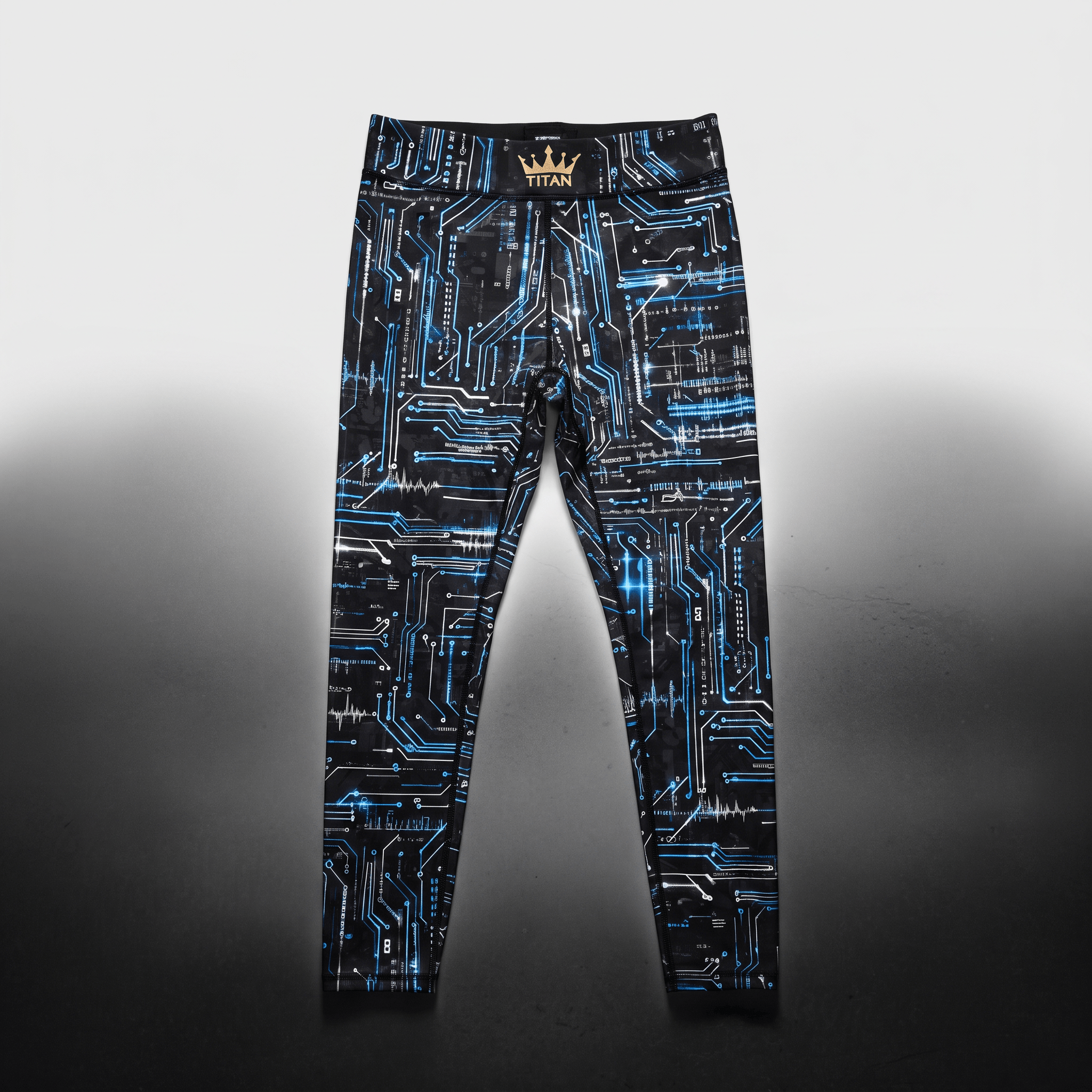 Black athletic leggings featuring a blue circuit board print and a gold crown logo on the waistband.