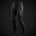 Black TITAN compression full-length tights featuring vertical gold branding on the left thigh.