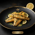Golden French sole fillets with herbs and lemon slices on a black plate with a gold crown logo. Titan Sport Global.