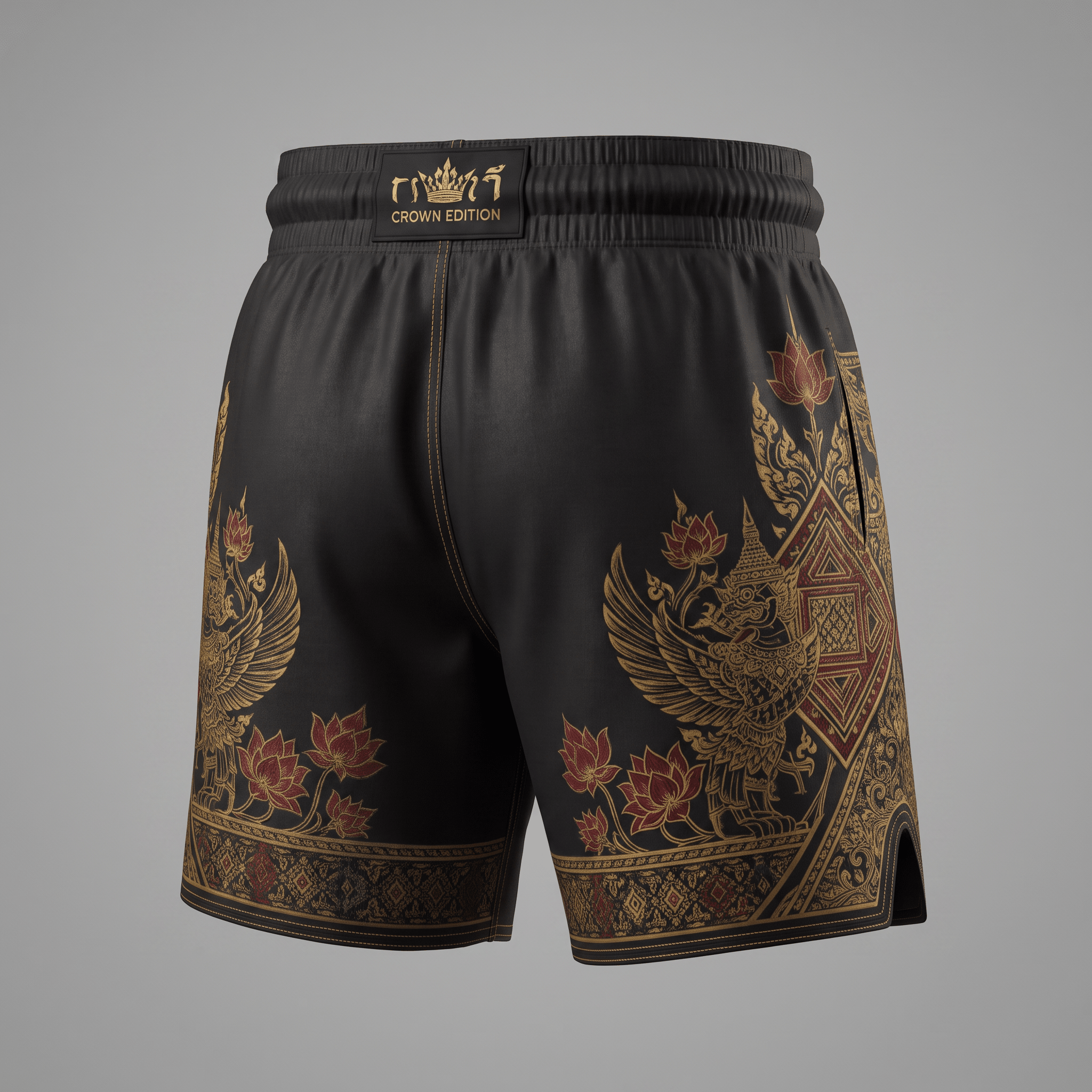 Black Muay Thai shorts with gold and red traditional Thai patterns and Crown Edition waistband.