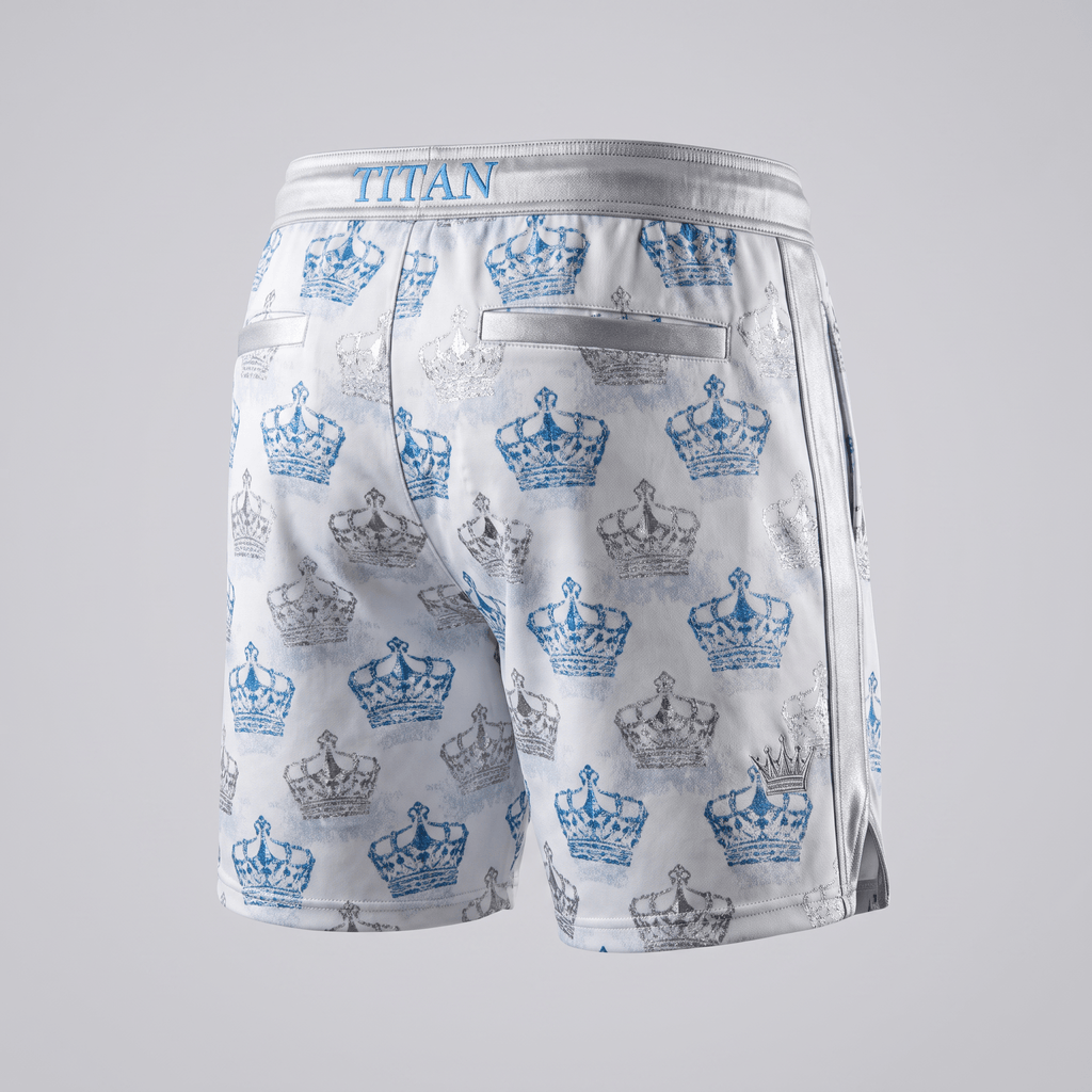 White athletic shorts with blue and silver crown pattern, silver waistband with Titan branding, and back pockets.