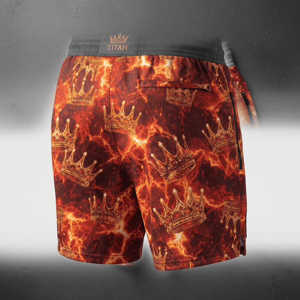 Titan athletic shorts in red and orange flame print with gold crowns and a dark waistband.