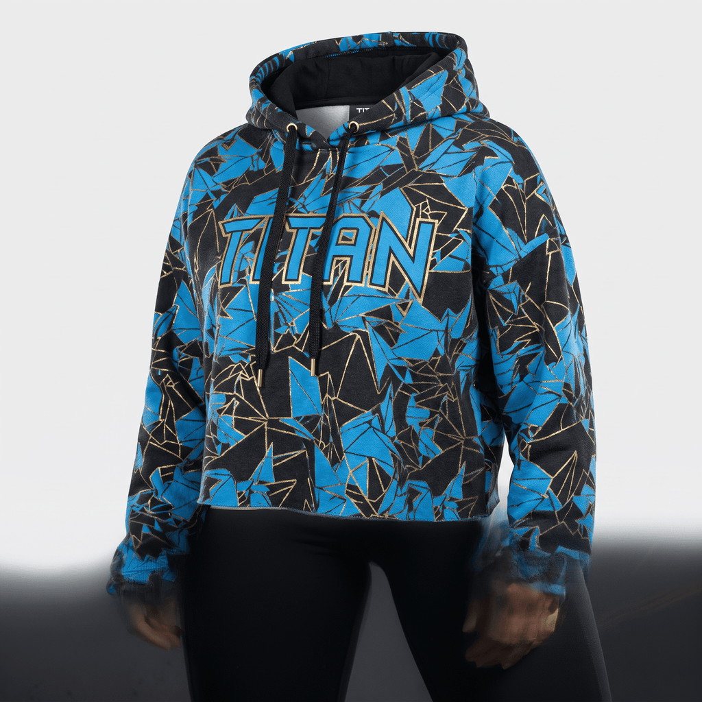 Black, blue, and gold geometric pattern crop hoodie featuring the word Titan across the chest.