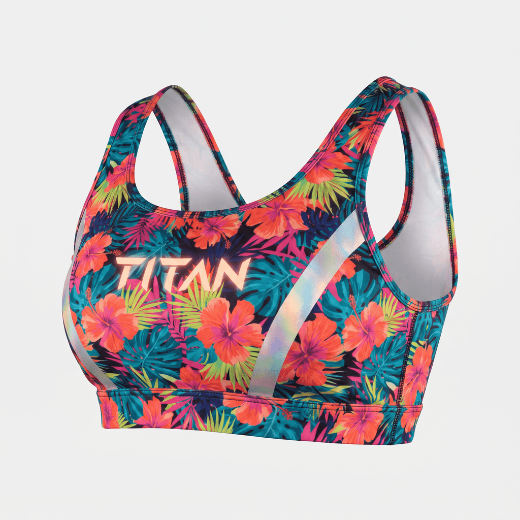 Titan sports bra in dark blue with vibrant pink and orange tropical floral print and reflective side straps.
