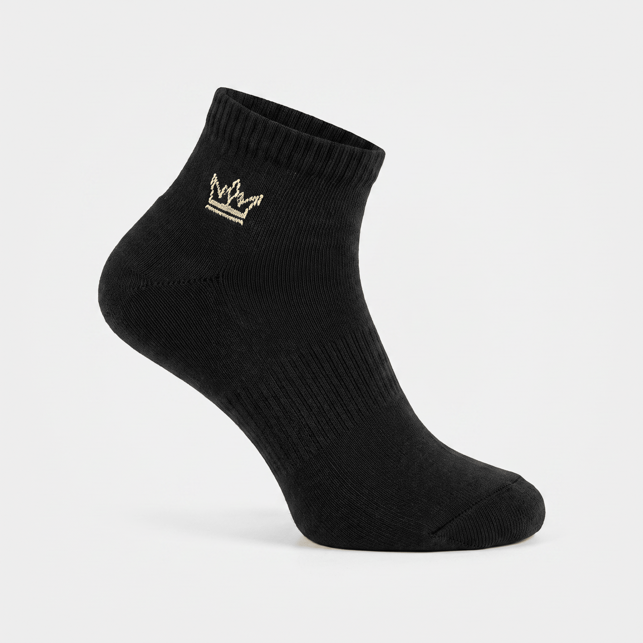 Black ankle sock featuring an embroidered gold crown logo on a white background.
