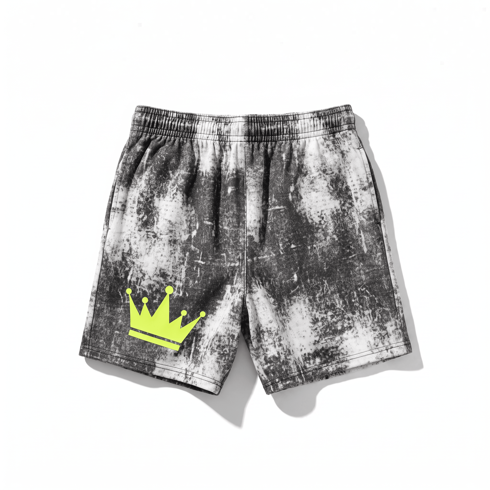 Black and white acid wash sweat shorts with an elastic waist and a neon yellow crown graphic on the left leg.