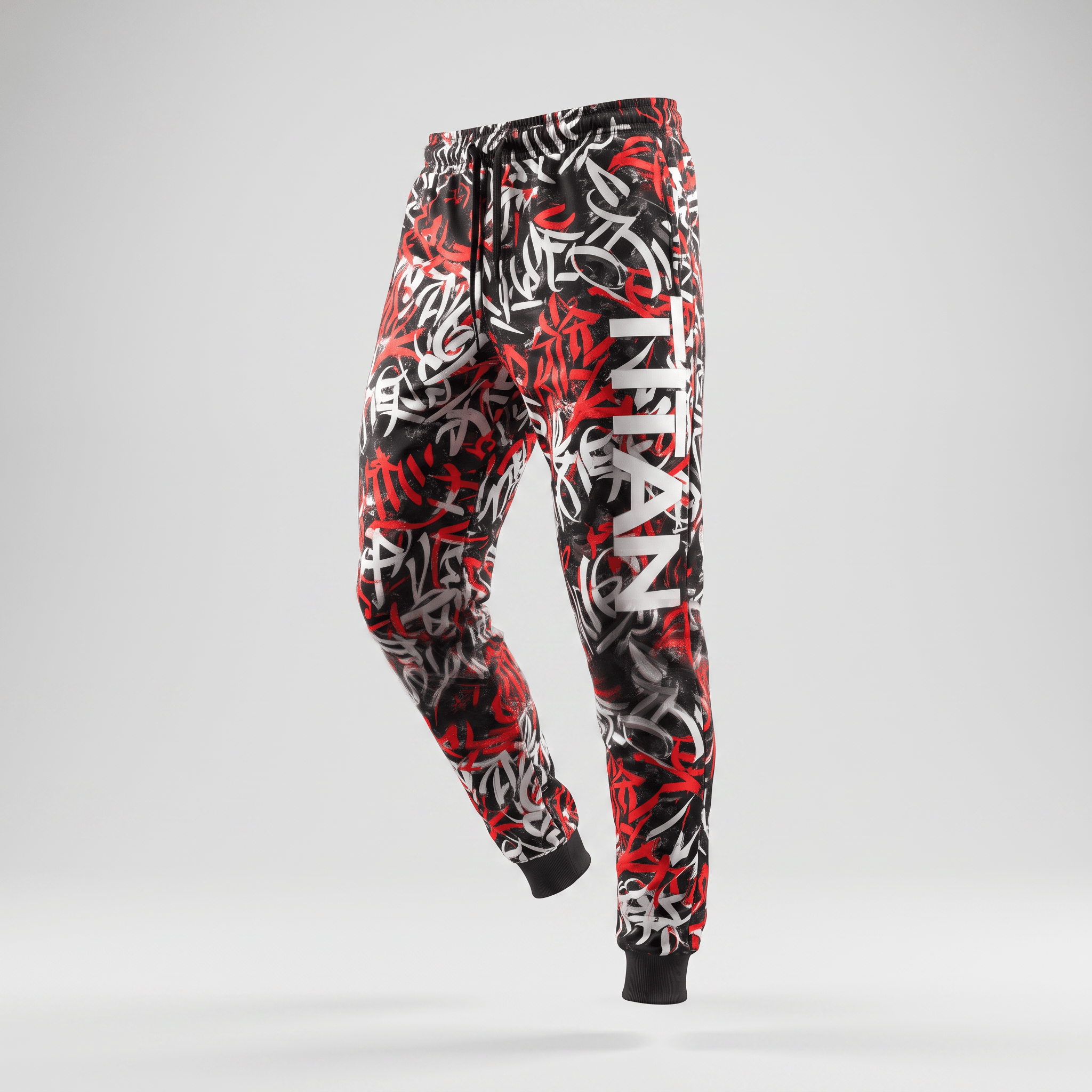 Black, red, and white graffiti print sweatpants with a vertical Titan logo on the left leg and drawstring waist.