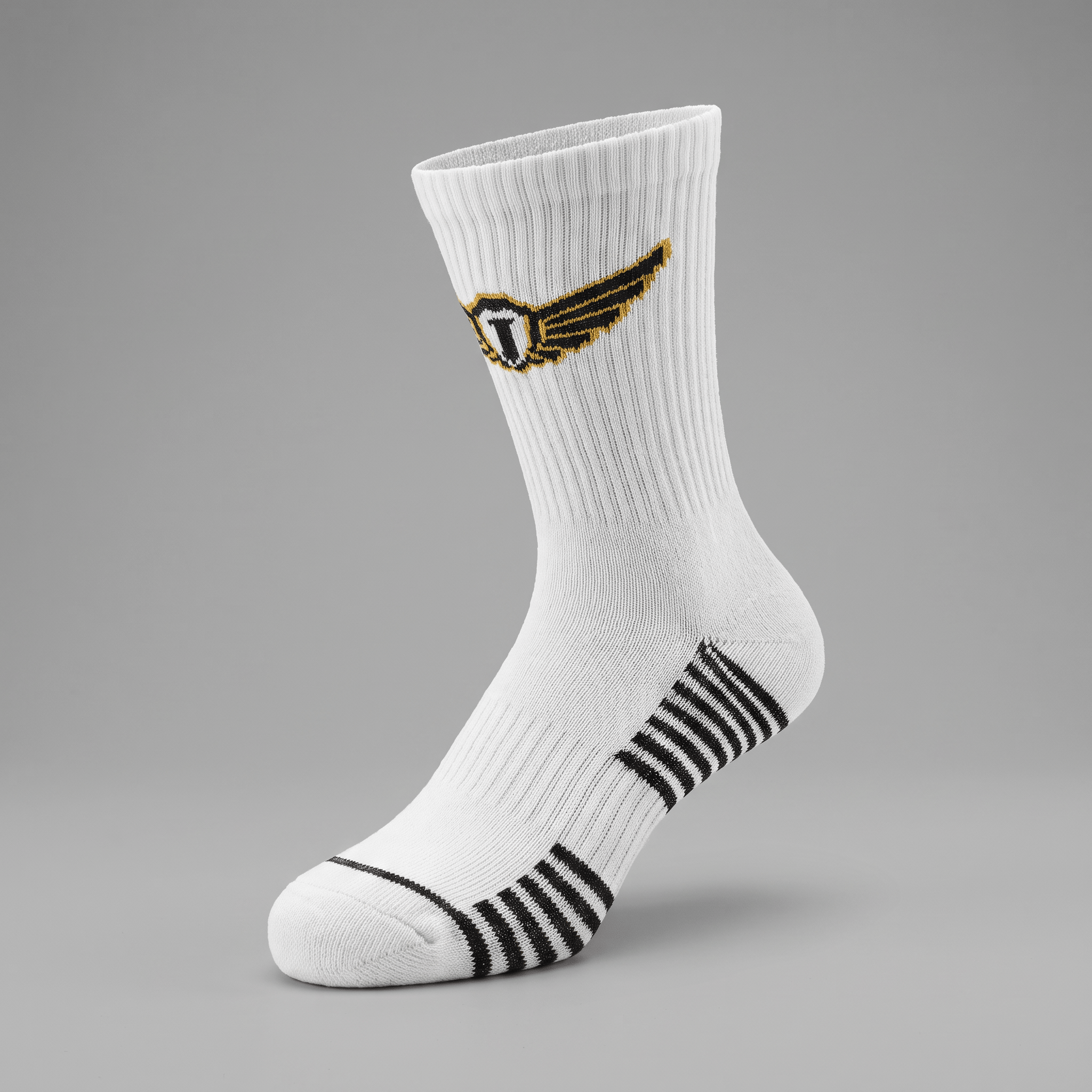 White athletic crew sock with a gold and black winged logo, black and white striped arch support, and ribbed cuff.