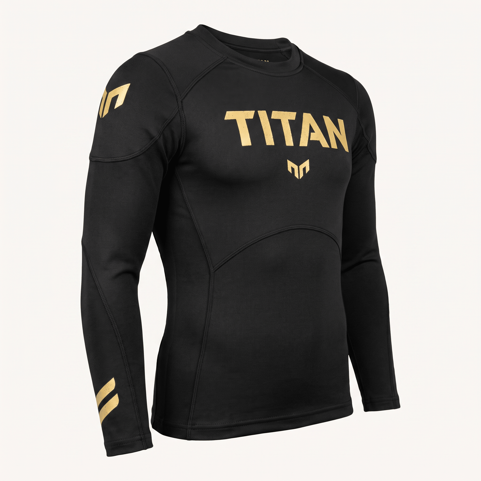 Black long-sleeve athletic rash guard with gold Titan branding across the chest and shoulder.