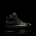 TITAN Dominator black high-top sneaker with gold accents, metallic branding, and a textured rubber sole.