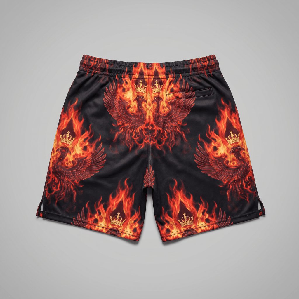 Black shorts with red and orange flame, phoenix, and crown graphic print on a neutral background.