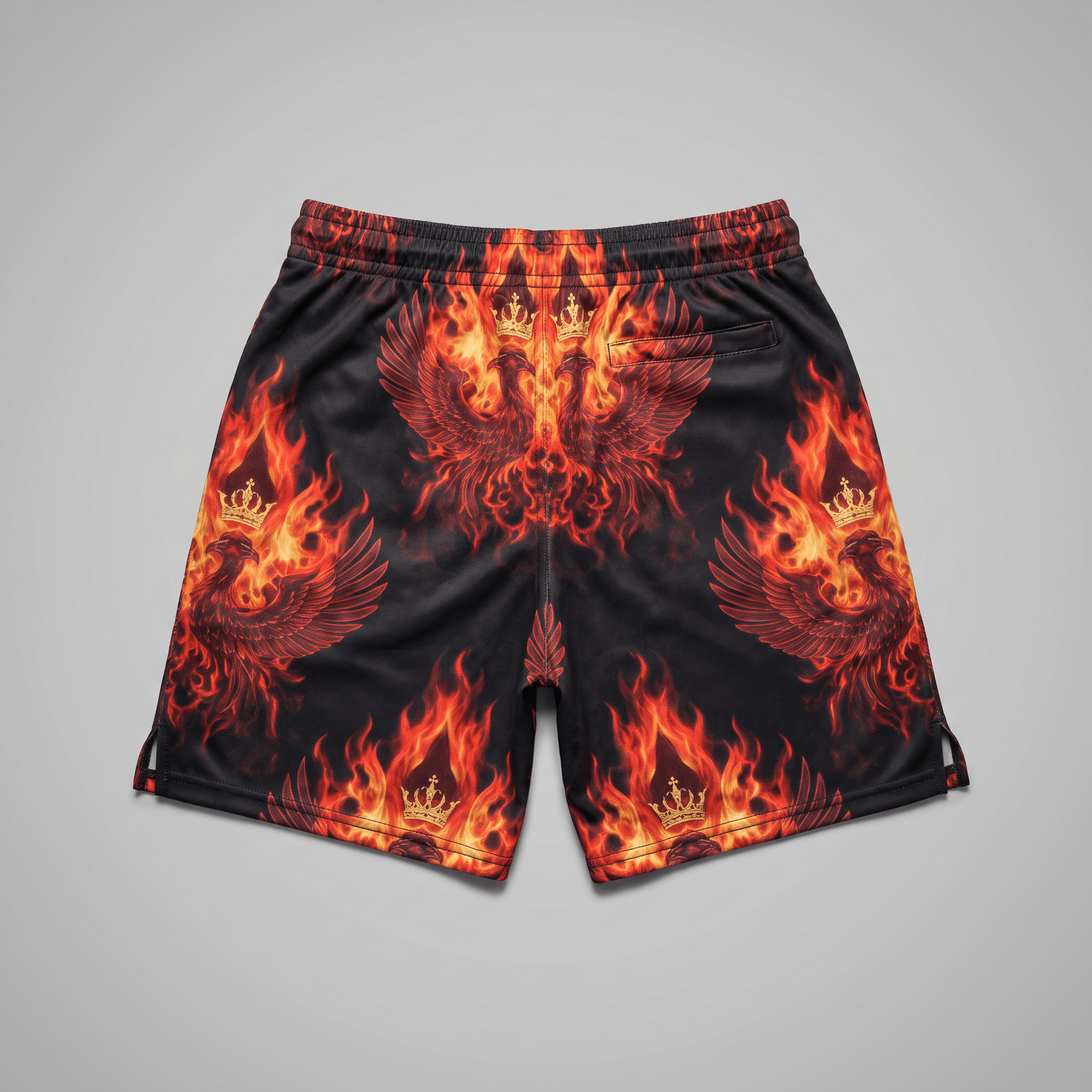 Black shorts with red and orange flame, phoenix, and crown graphic print on a neutral background.