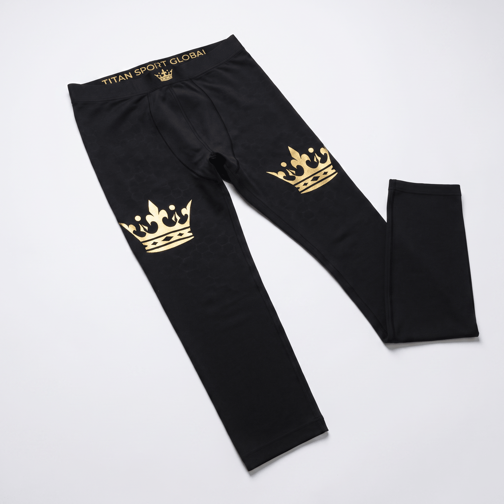 Black athletic leggings with gold crown graphics on the thighs and Titan Sport Global waistband.