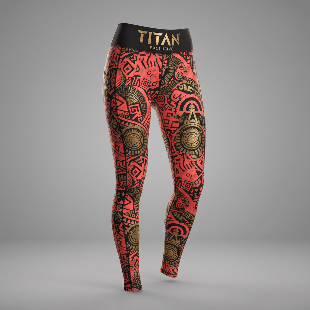 Red and black athletic leggings with gold geometric print and Titan Exclusive waistband.