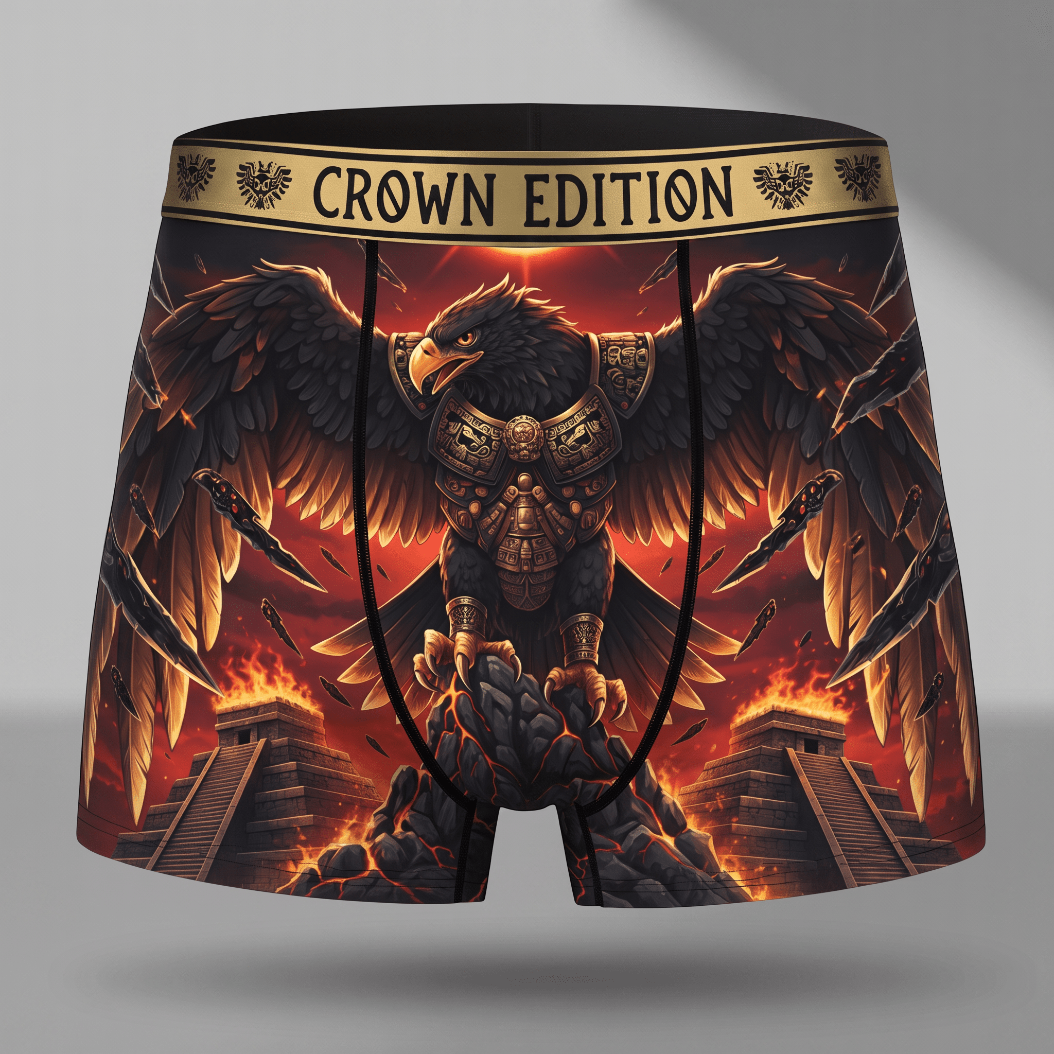 Crown Edition black boxer briefs featuring an armored eagle graphic over fiery Aztec ruins and glowing red sky.